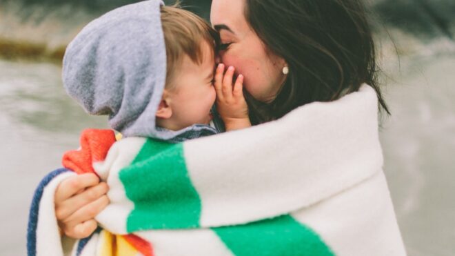 beach-holding-love-blanket-mother-toddler-warm-son-hug-cuddle-kiss-snuggle-cozy_t20_opgn0y