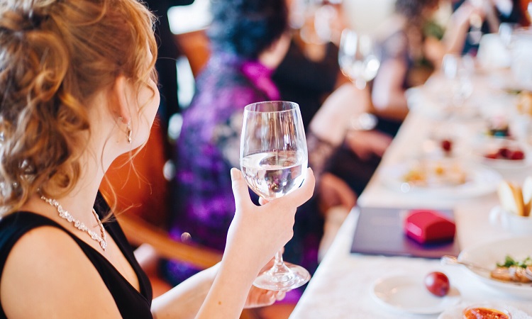 woman-cheers-table-party