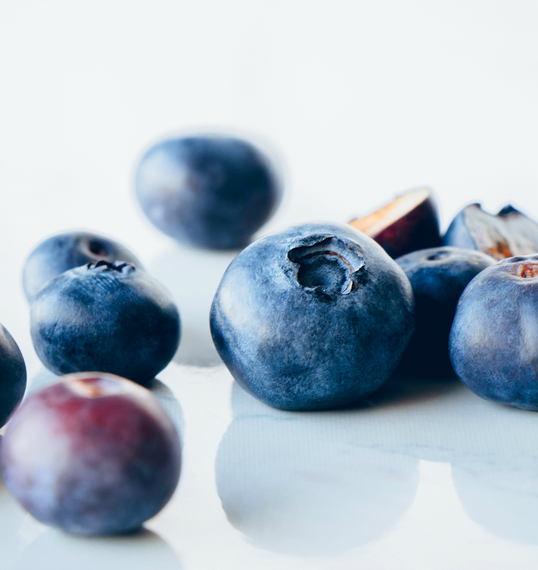 Fresh organic blueberries on a marble background, close up