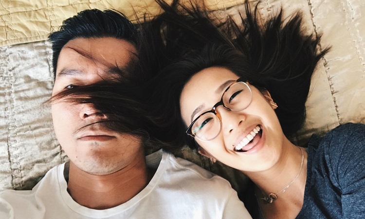 fun-couple-selfie-bed