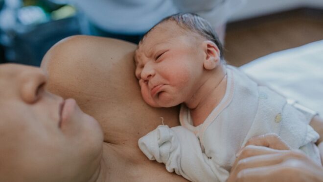 mom-holding-baby-newborn-crying