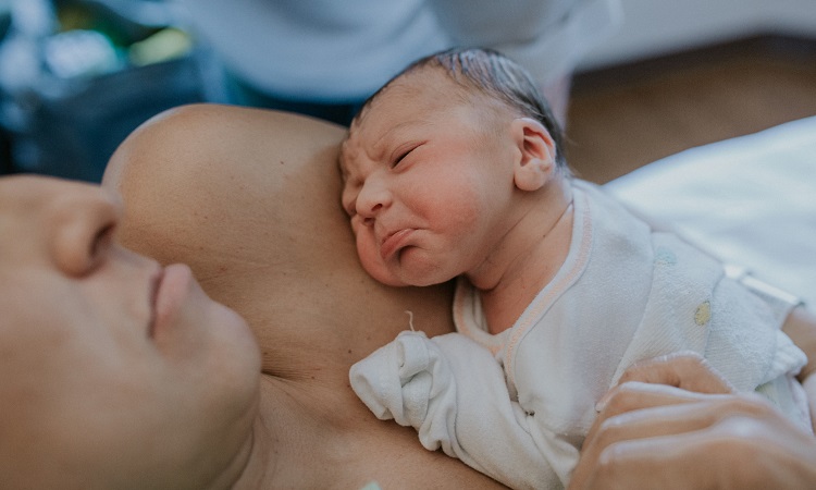 mom-holding-baby-newborn-crying
