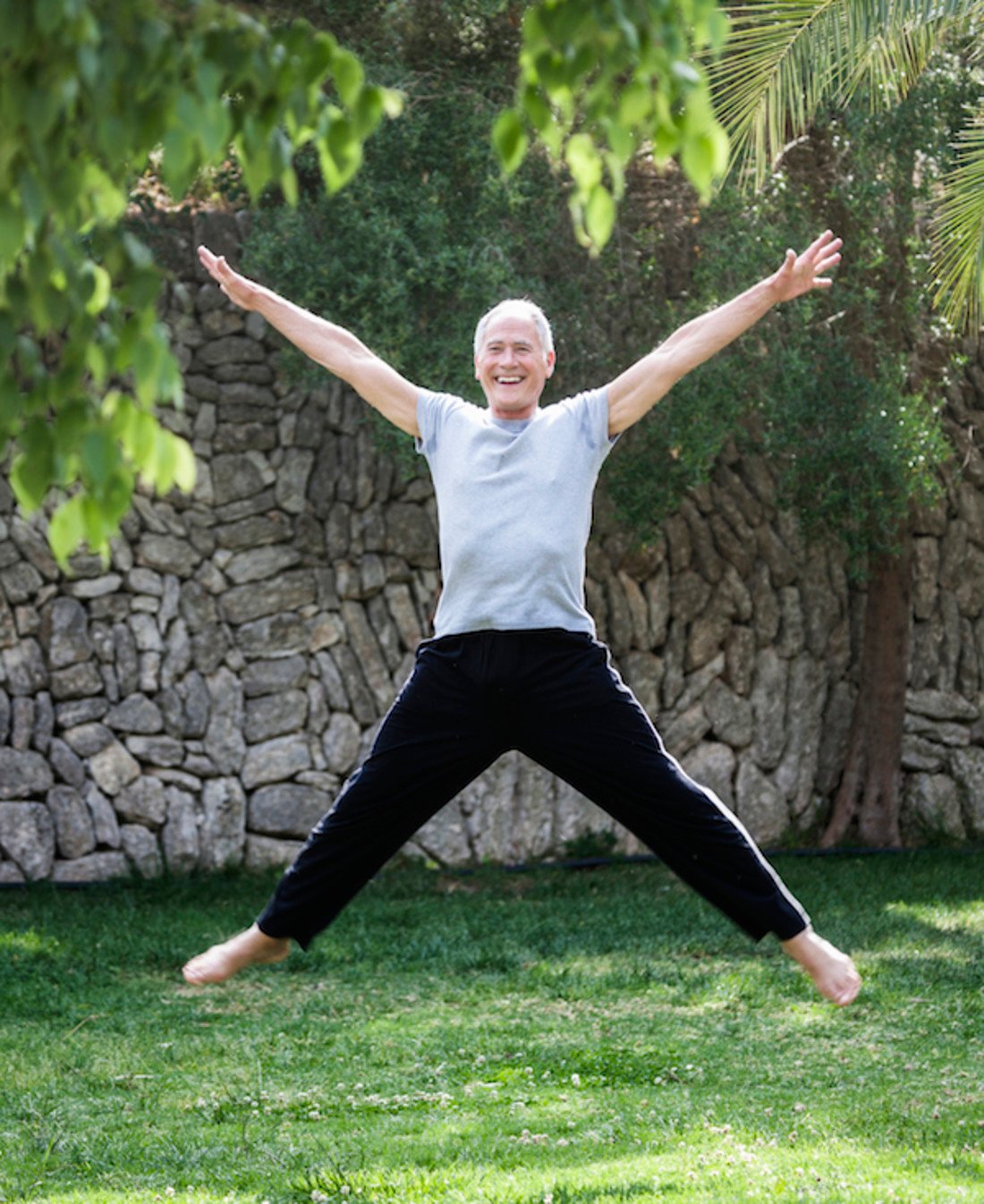234194-mature-man-in-mid-air-doing-star-jump-1.jpg