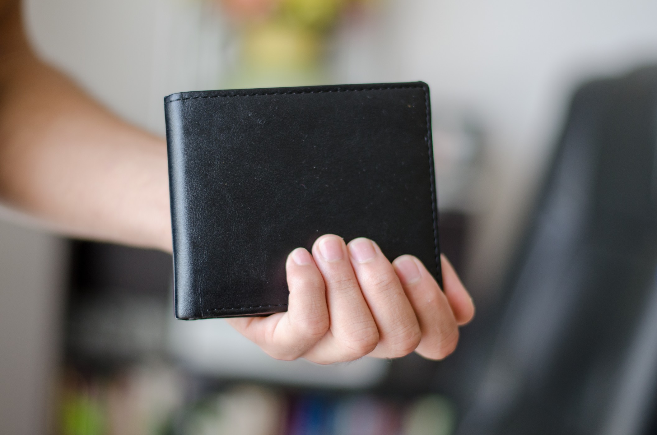 236671-hand-holding-wallet.jpg