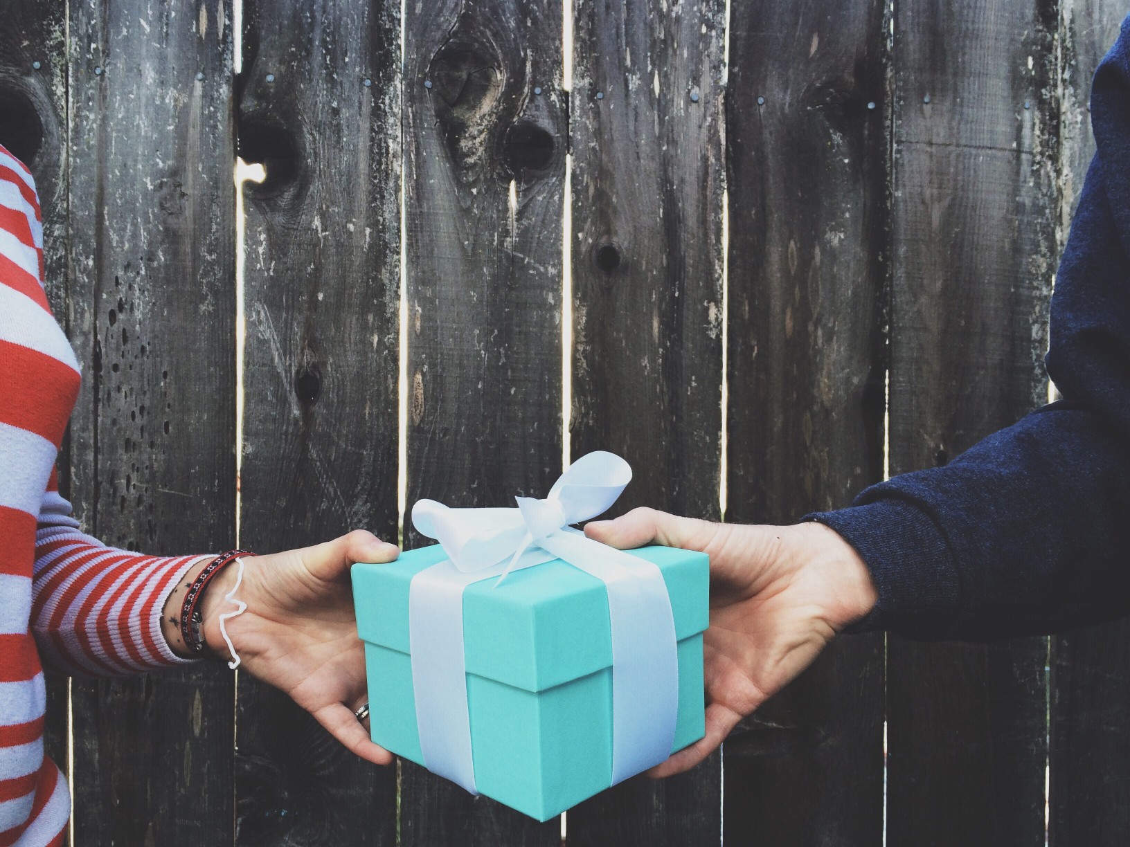 239404-gift-exchange-hands.jpg