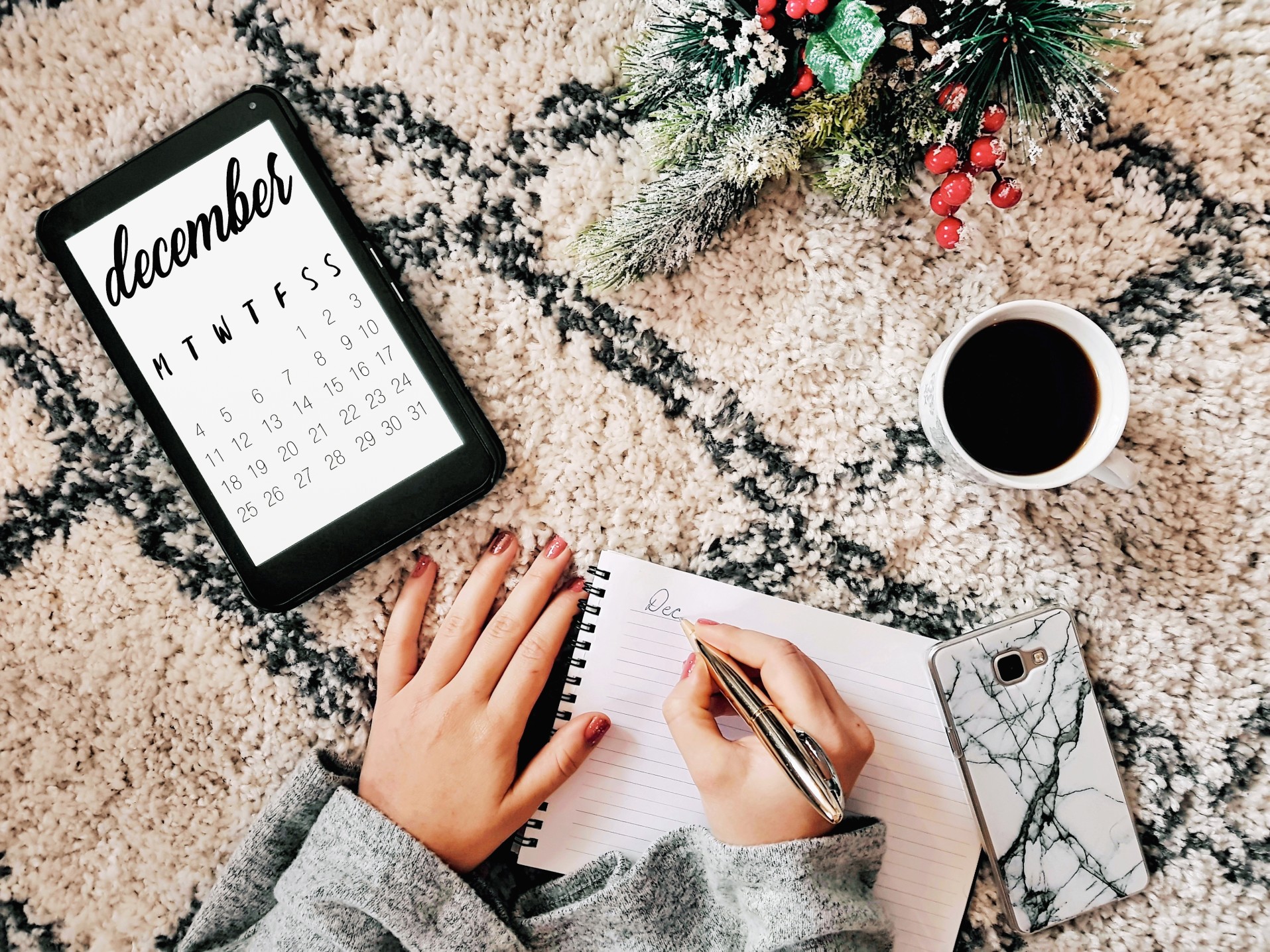 calendar-flat-lay-a-young-millenial-writing-on-a-notepad-with-a-calendar-on-a-tablet-beside-her-a-cup_t20_zvybdk