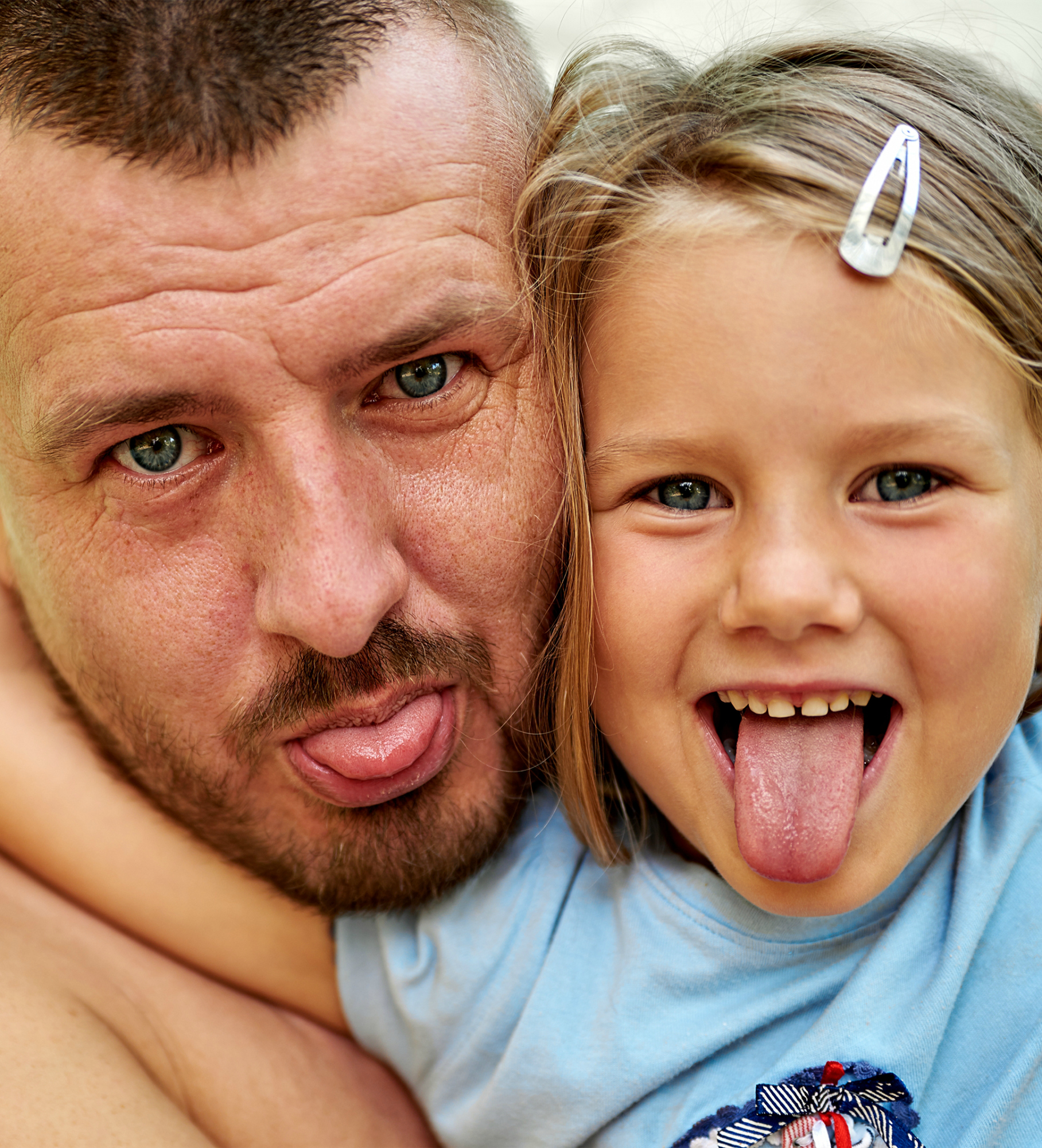 Father plays with his little daughter