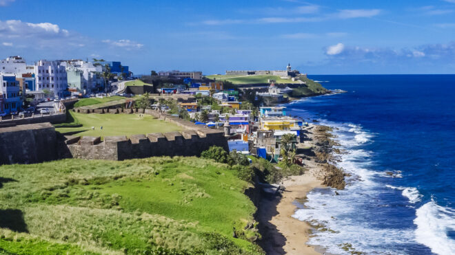 Coastline of Puerto Rico with Houses of Old San Juan - Panoramic View of the Coastline of Puerto Rico with Houses of Old San Juan and the Caribbean Sea