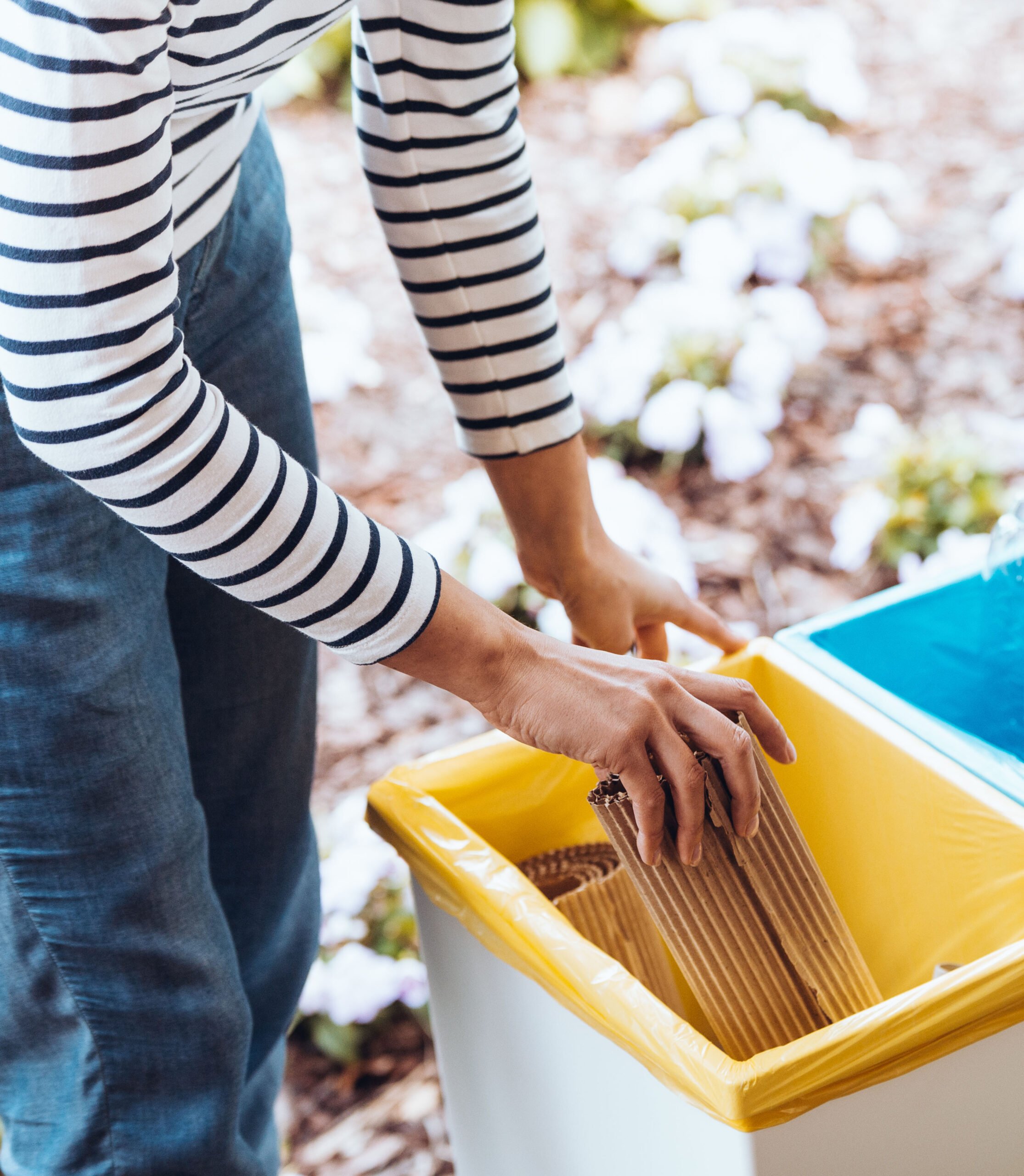 Person disposing paper to bin