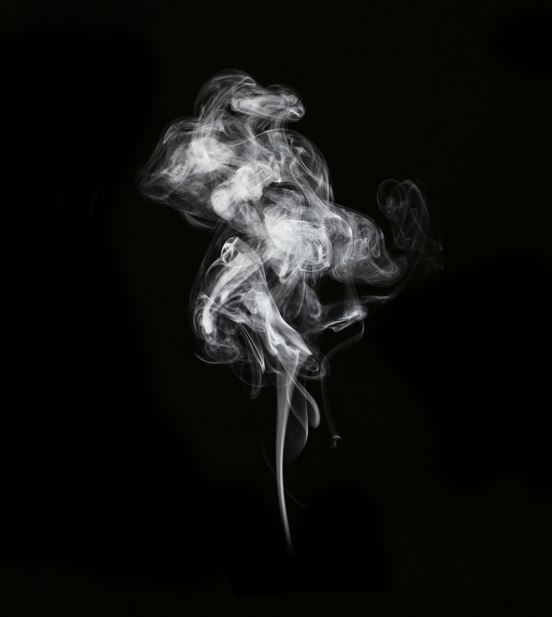abstract white smoke in dark background.