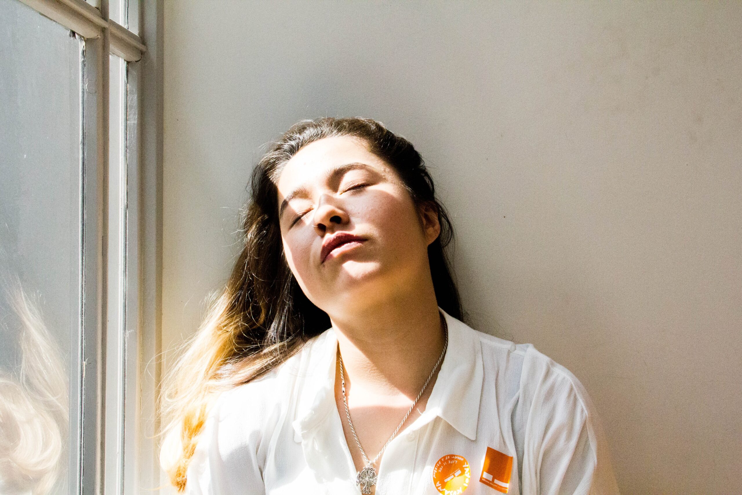 tired-woman-by-window