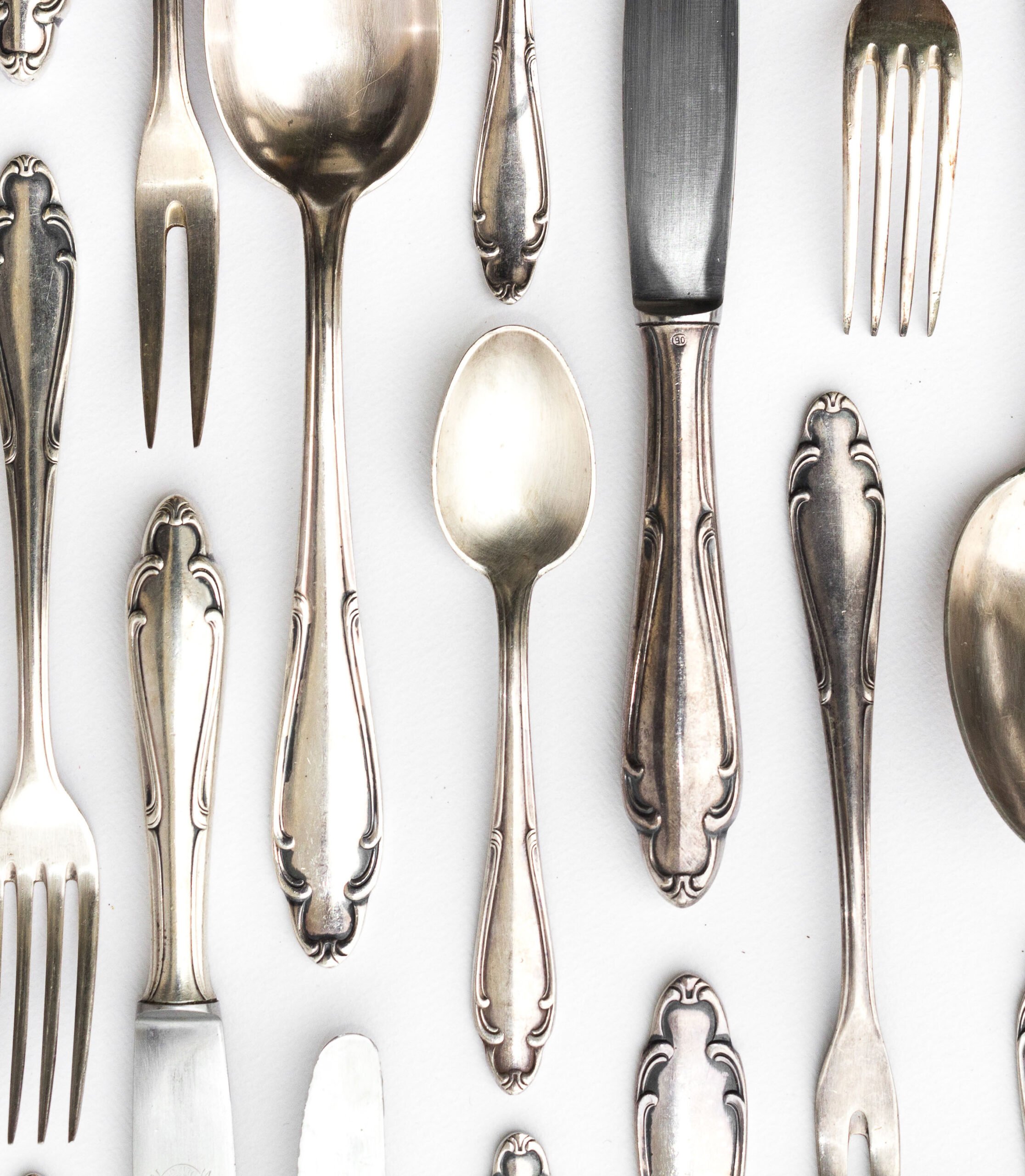 beautiful sterling cutlery set on white background