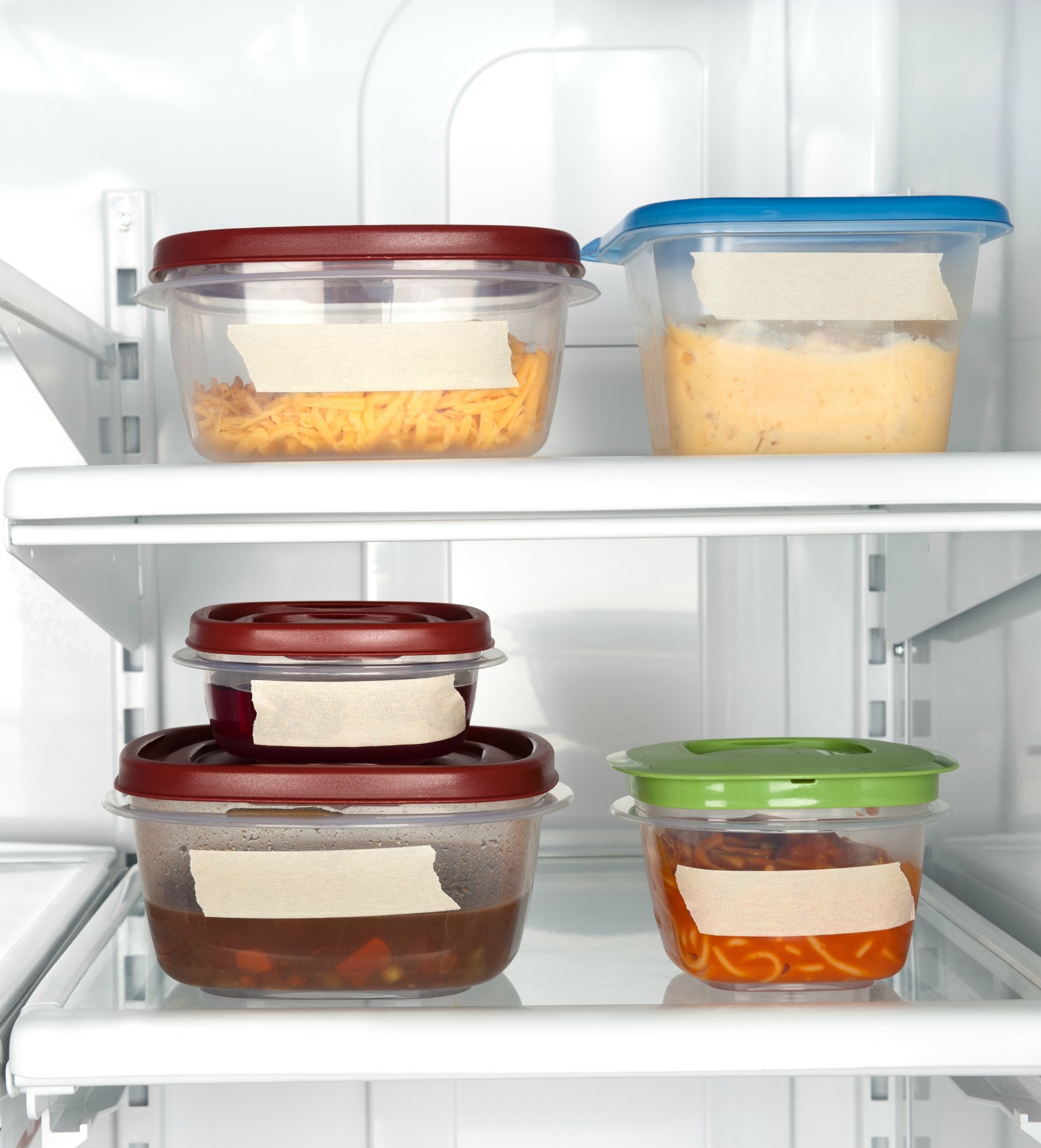Leftovers in a refrigerator with blank tape for copy.