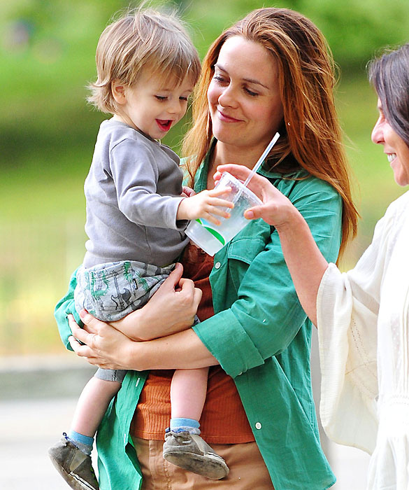 Alicia Silverstone showers her son, Bear Blue, with lots of hugs and kisses in between takes of filming "Gods Behaving Badly" in New York City
