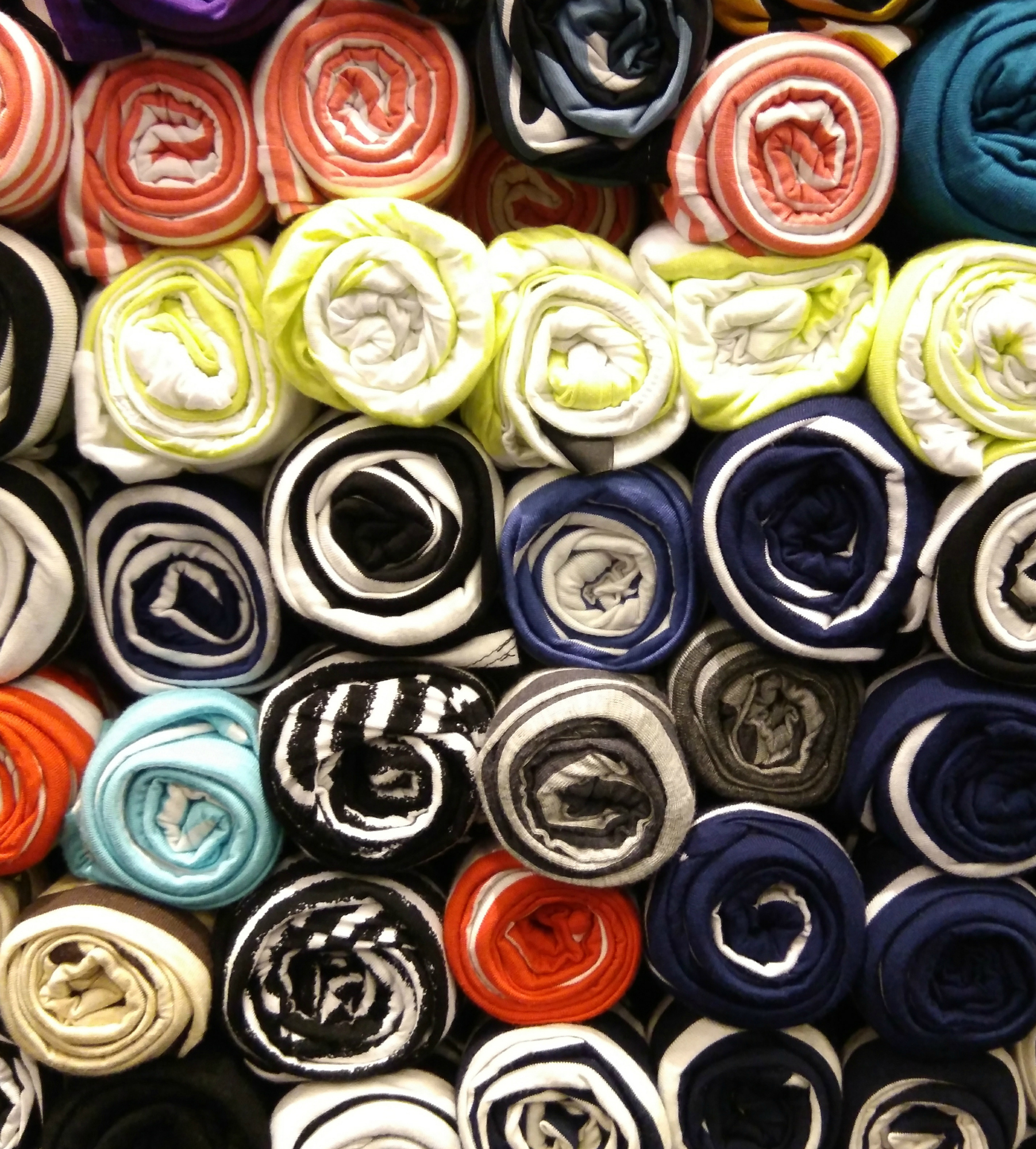 Pants or underwear are stacked rolls. Colorful underwear.