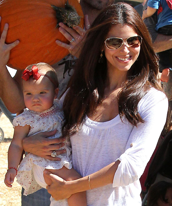 Roselyn Sanchez dotes over baby daughter Sebella as she takes her pumpkin shopping for her first Halloween with husband Eric Winter