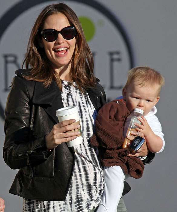 Jennifer Garner is full of smiles as she carries baby Samuel for an early morning coffee run with daughter Seraphina in Los Angeles
