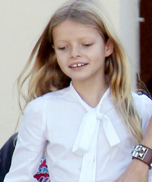 Gwyneth Paltrow looks like a very happy mom as she picks her children Moses and Apple up from school in Los Angeles