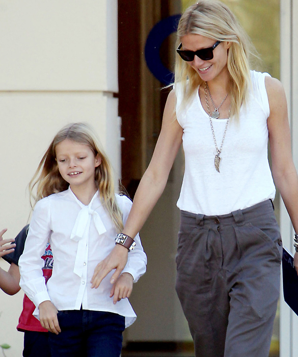 Gwyneth Paltrow looks like a very happy mom as she picks her children Moses and Apple up from school in Los Angeles