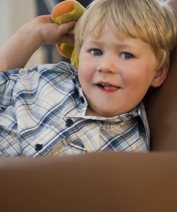 Portrait of a Little Boy with a Stuffed Animal