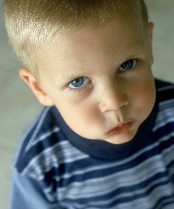 blonde toddler with puffed-out cheeks
