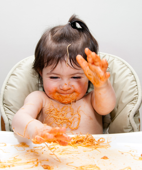 Happy baby funny messy eater
