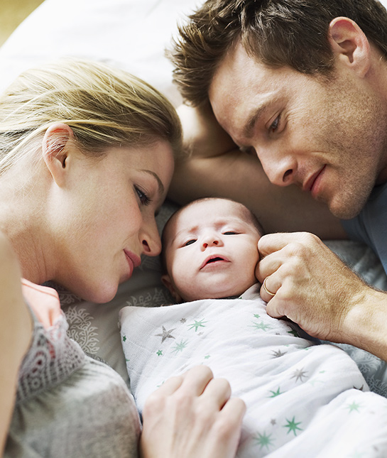 81586-9-mom-dad-baby-parents-bed-loving-bed-sunlight.jpg