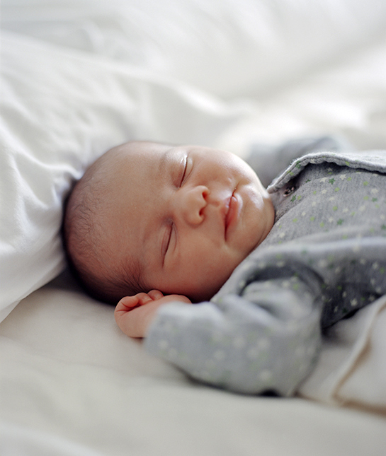82675-9-sleeping-baby-newborn-relaxed-peaceful-onesie-bed-daylig.jpg