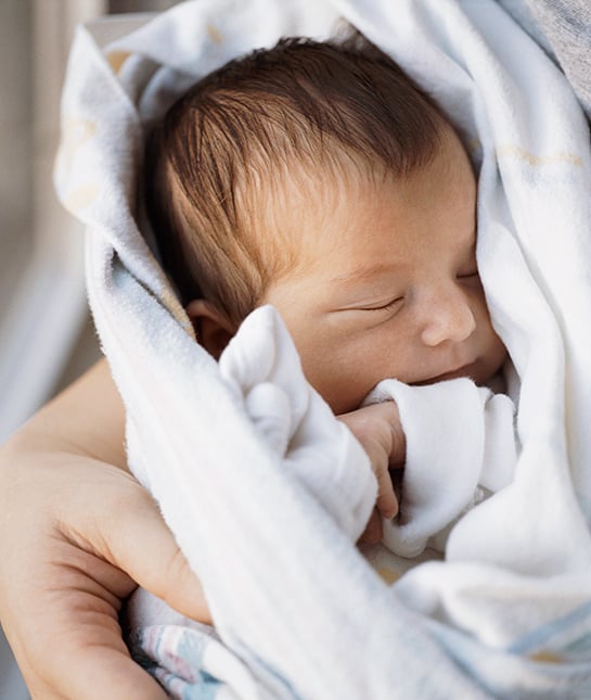 82680-12-baby-snuggling-holding-newborn-sleeping-peaceful-happy.jpg