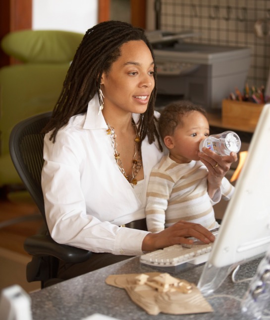 83003-mom-on-computer-feeding-baby.jpg