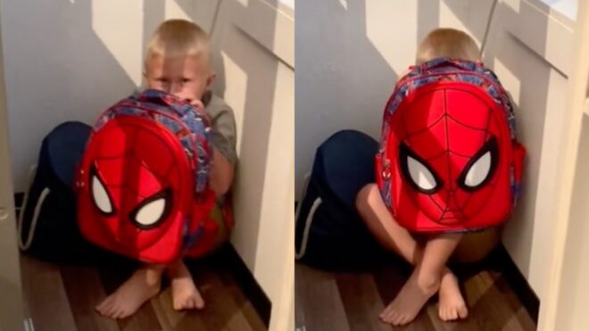 Weston Walton hides behind bulletproof backpack
