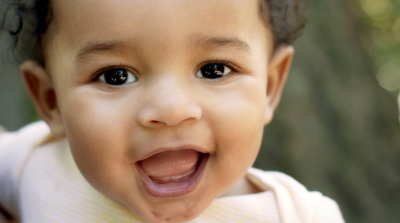 Close up cute African American baby outdoors
