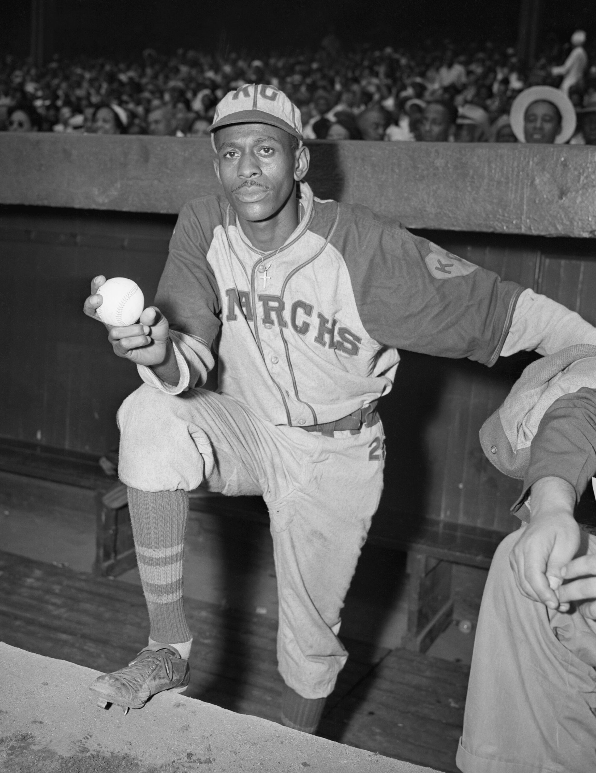 Pitcher Satchel Paige Standing in Dugout