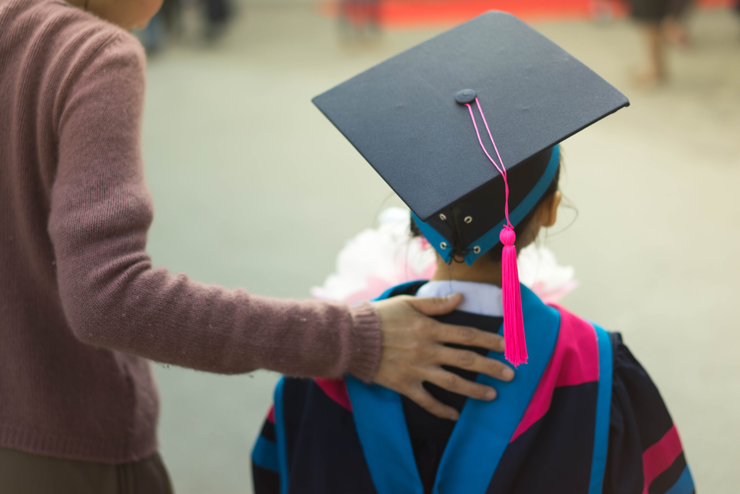 A little kid at graduation