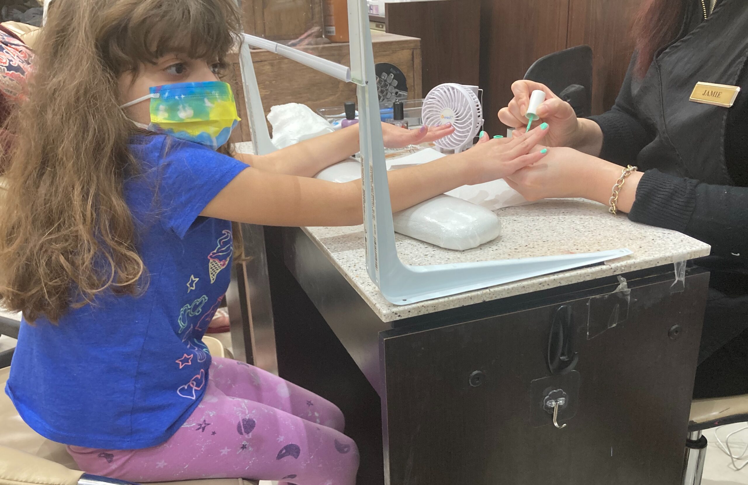 girl getting nails done