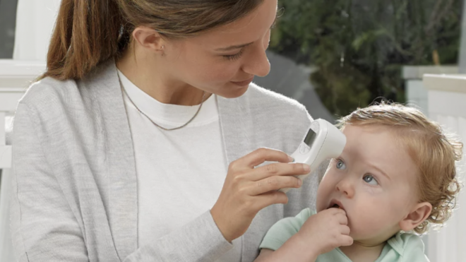 Mom with thermometer and baby