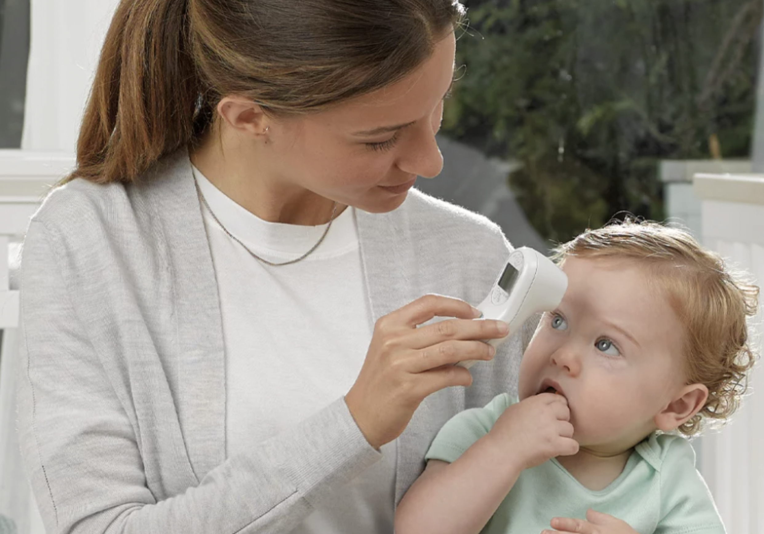 Mom with thermometer and baby