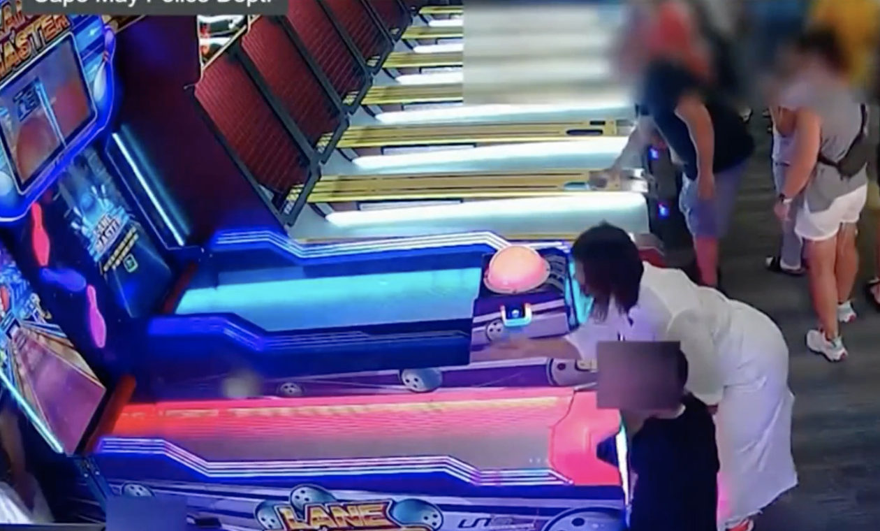 Woman playing skee ball game