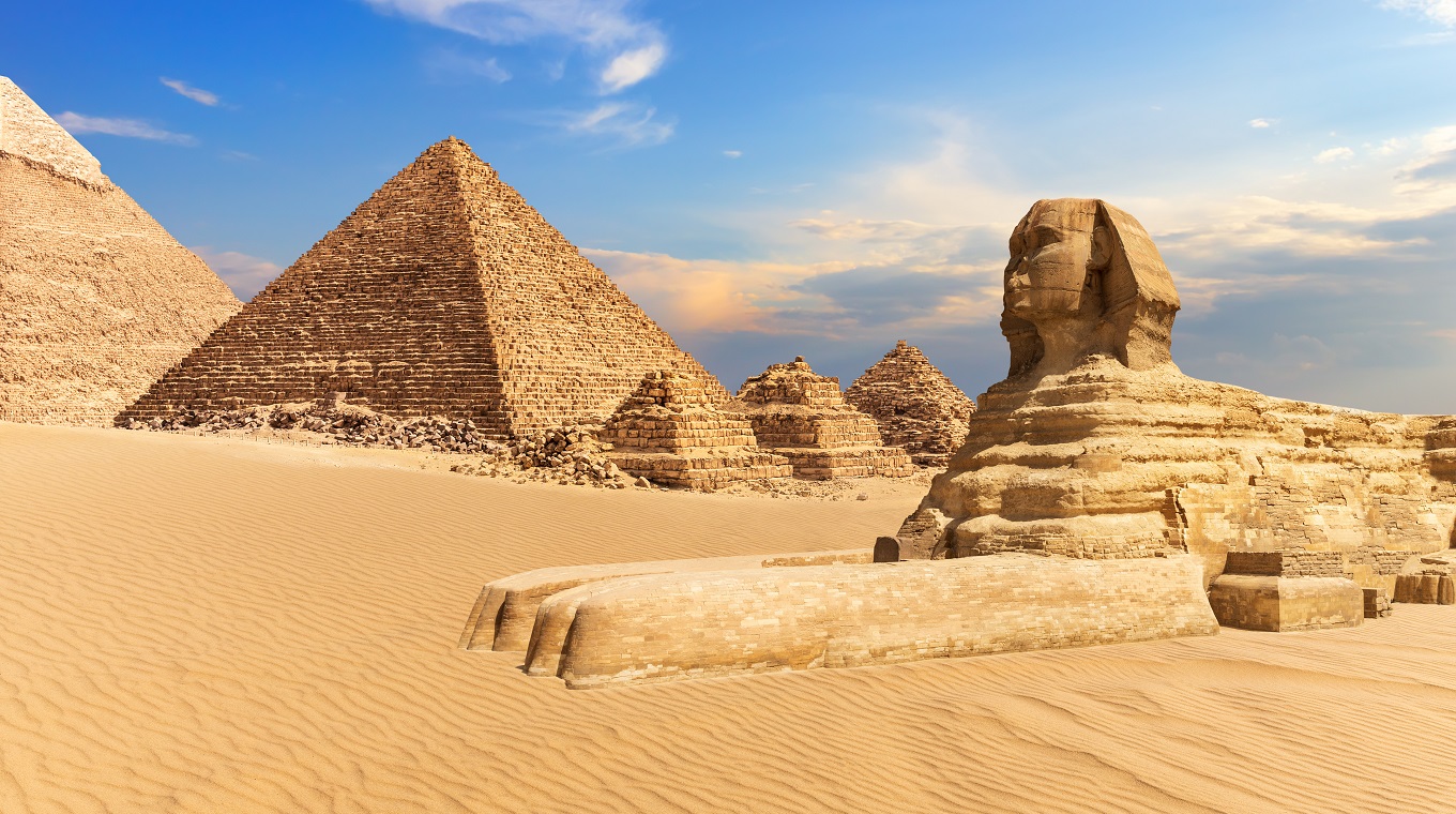 The Sphinx of Giza next to the Pyramids in the desert, Egypt