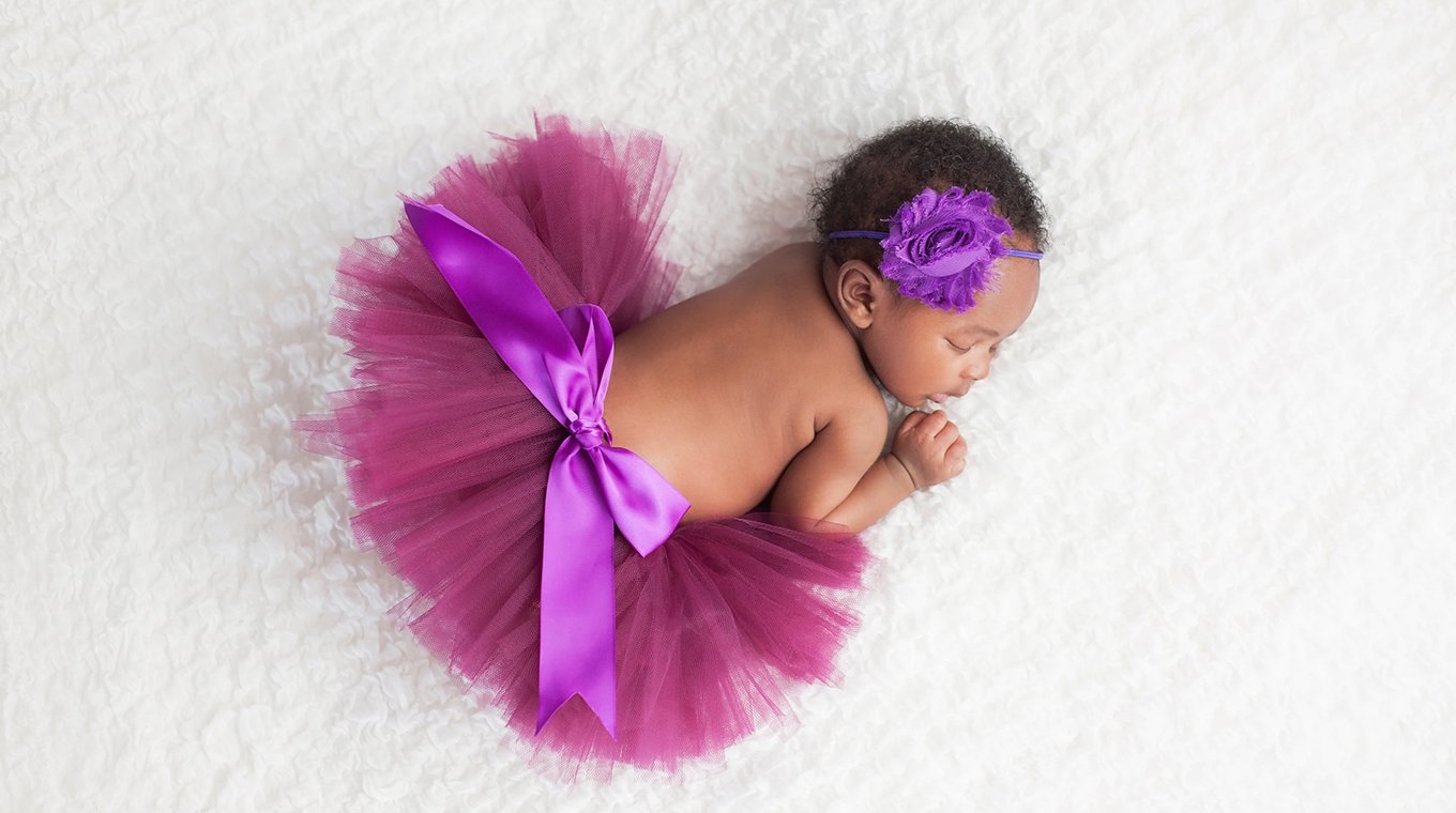 Newborn Baby Girl Wearing a Purple Tutu