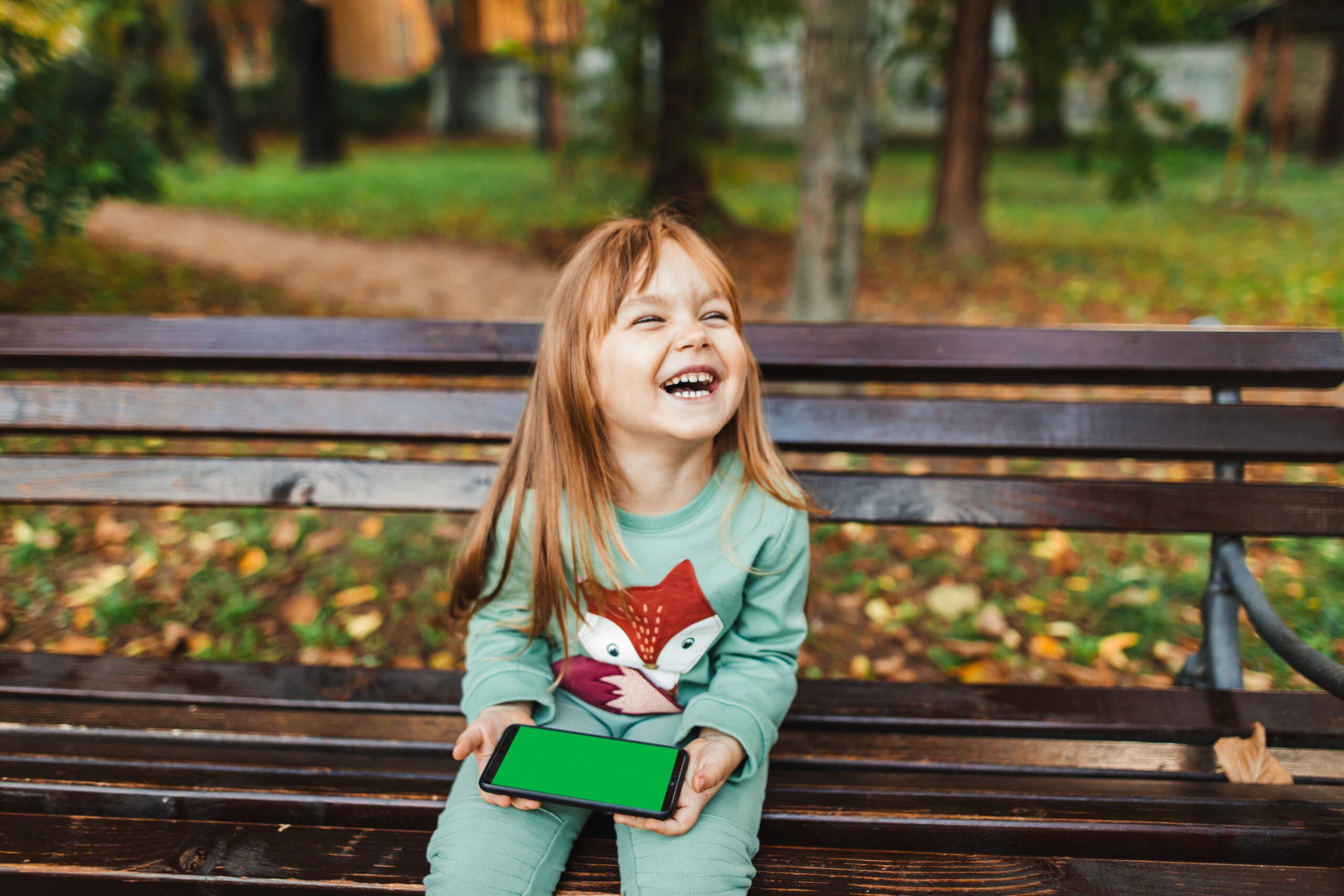 Happy girl holding smart phone