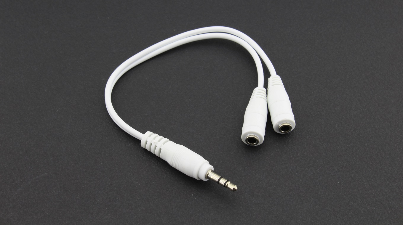 Earphones splitter cable, black background