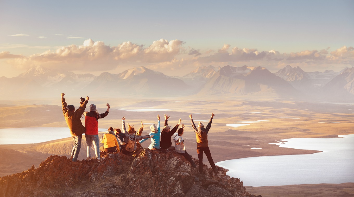 Large group of happy friends in mountains area
