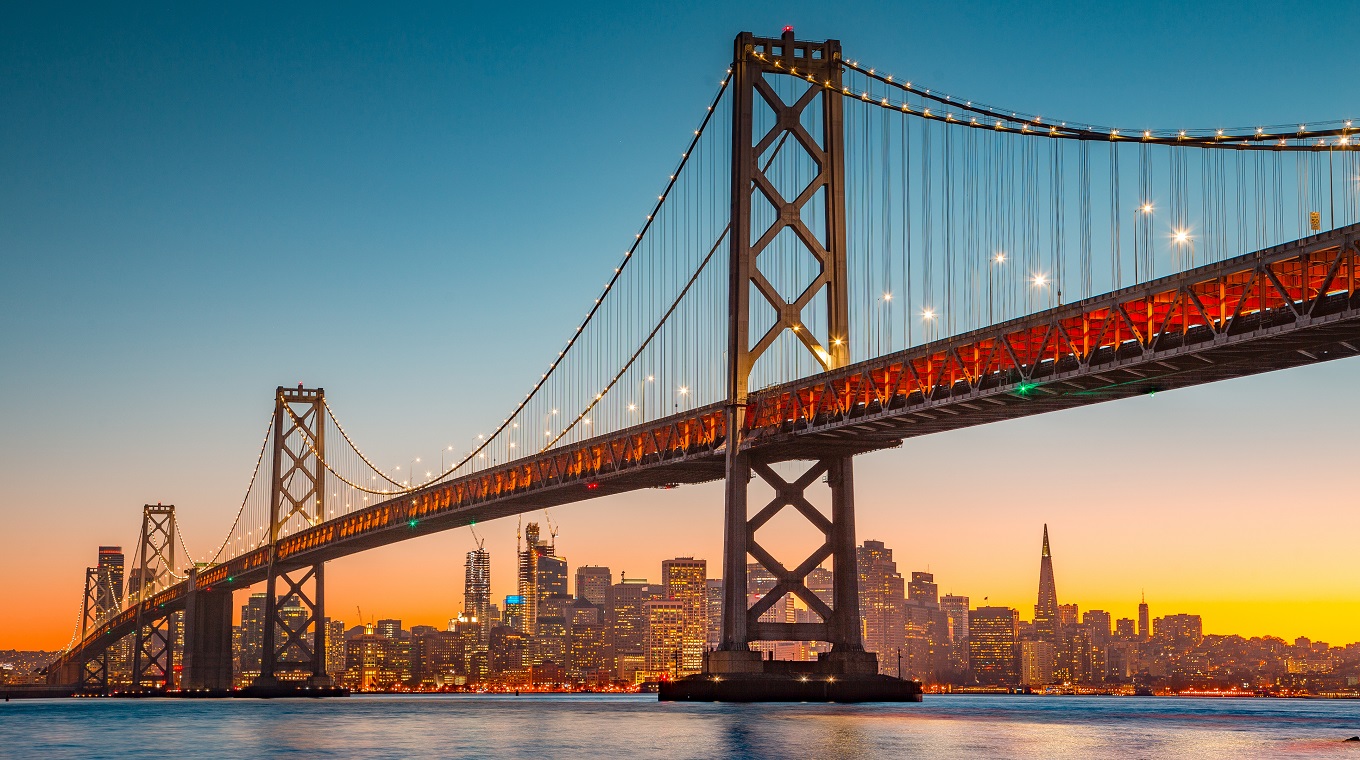 San Francisco skyline with Oakland Bay Bridge at sunset, California, USA