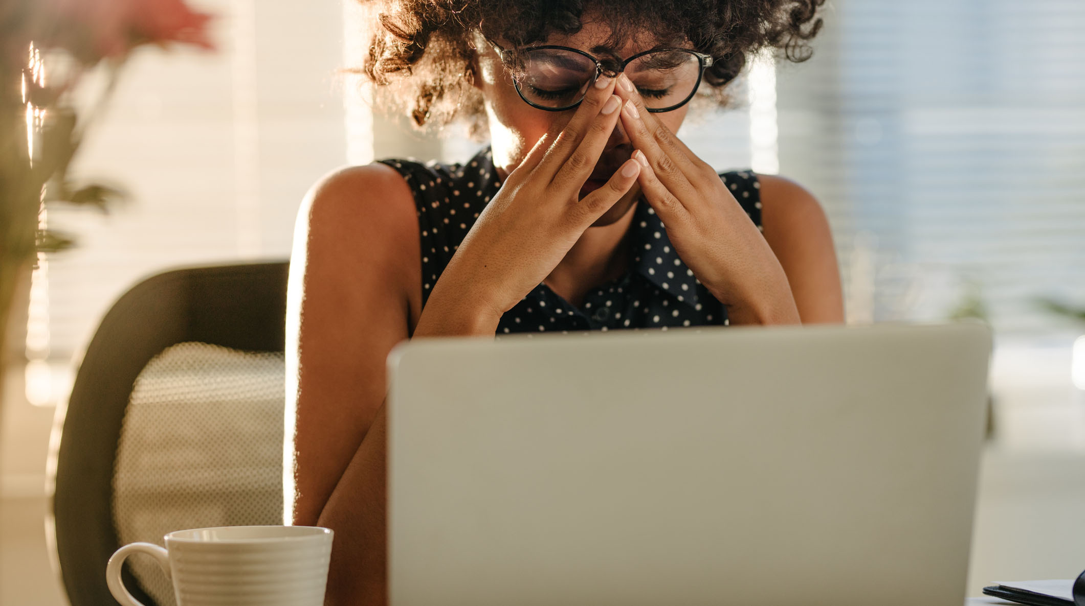 Stressed businesswoman sitting at desk