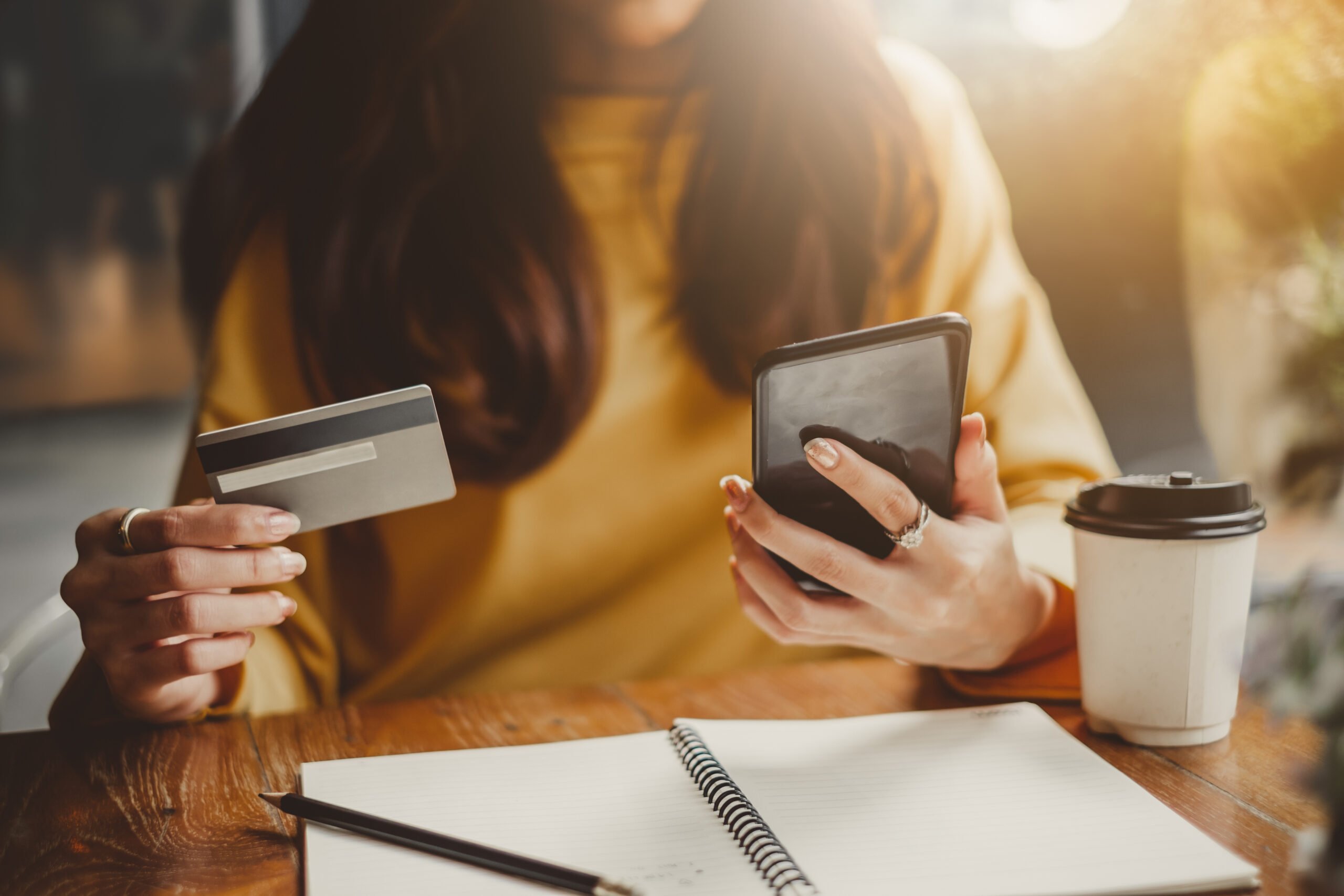 woman holding credit card