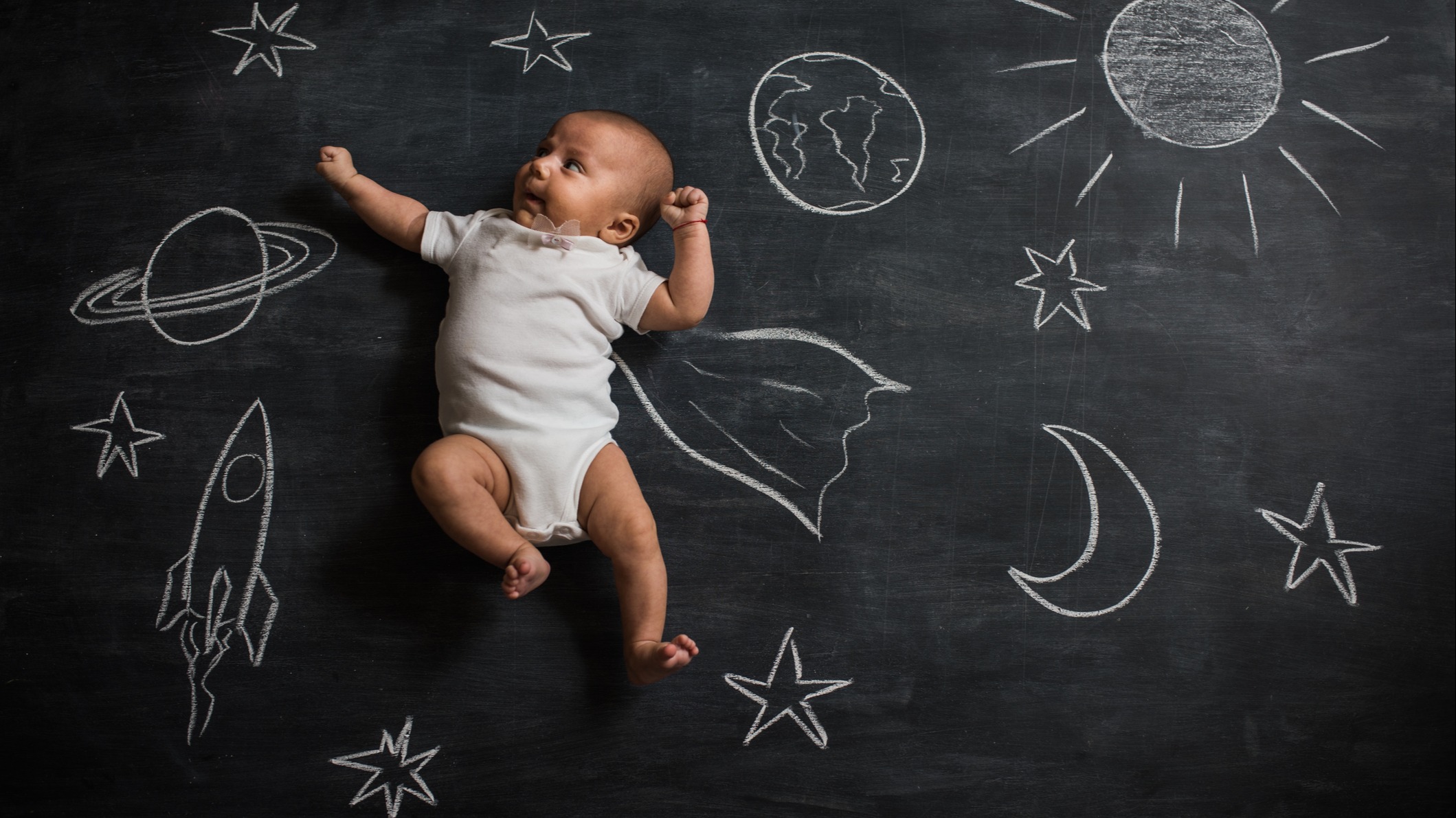 A baby posing with the universe
