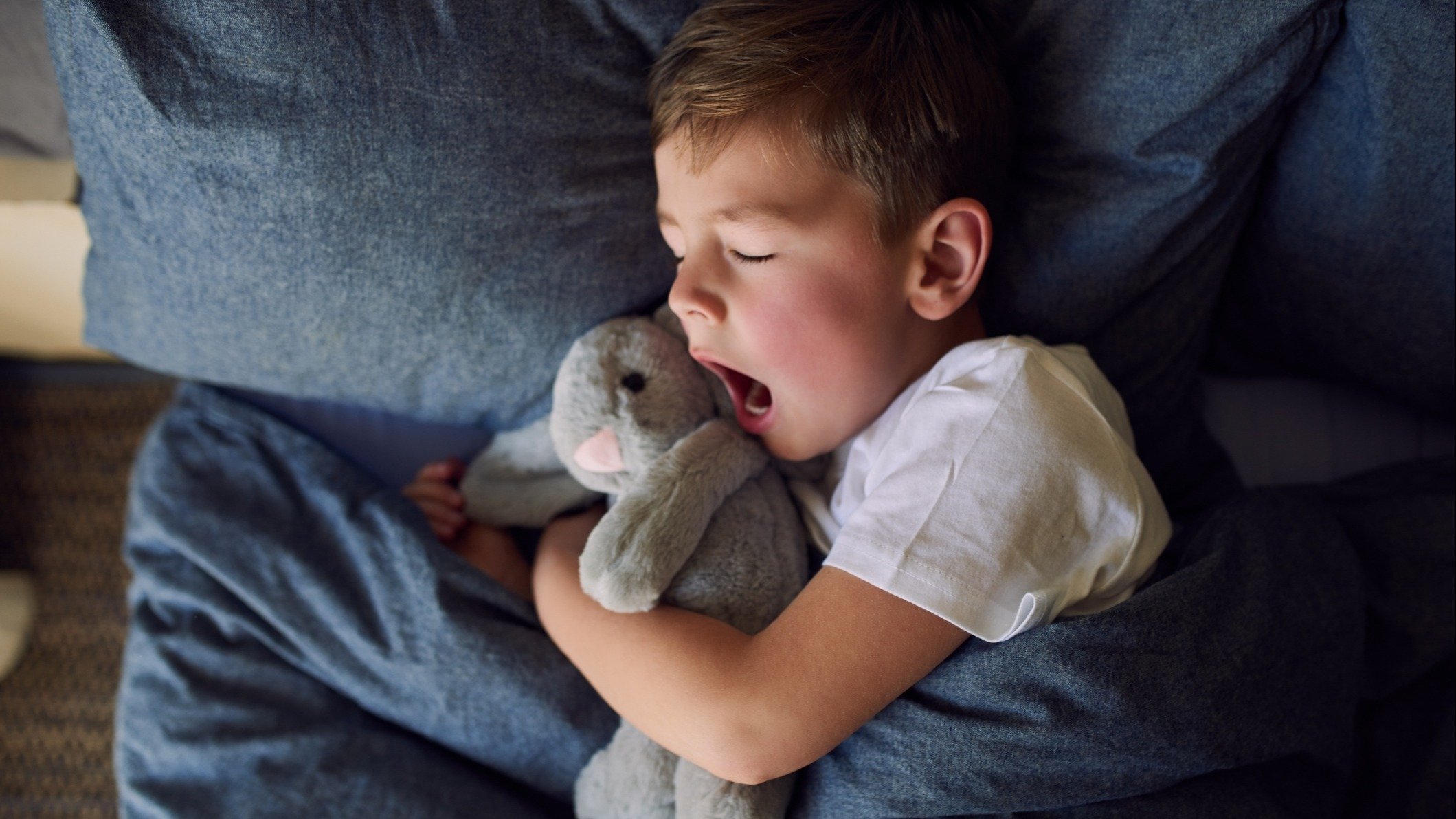 Kid sleeping in bed