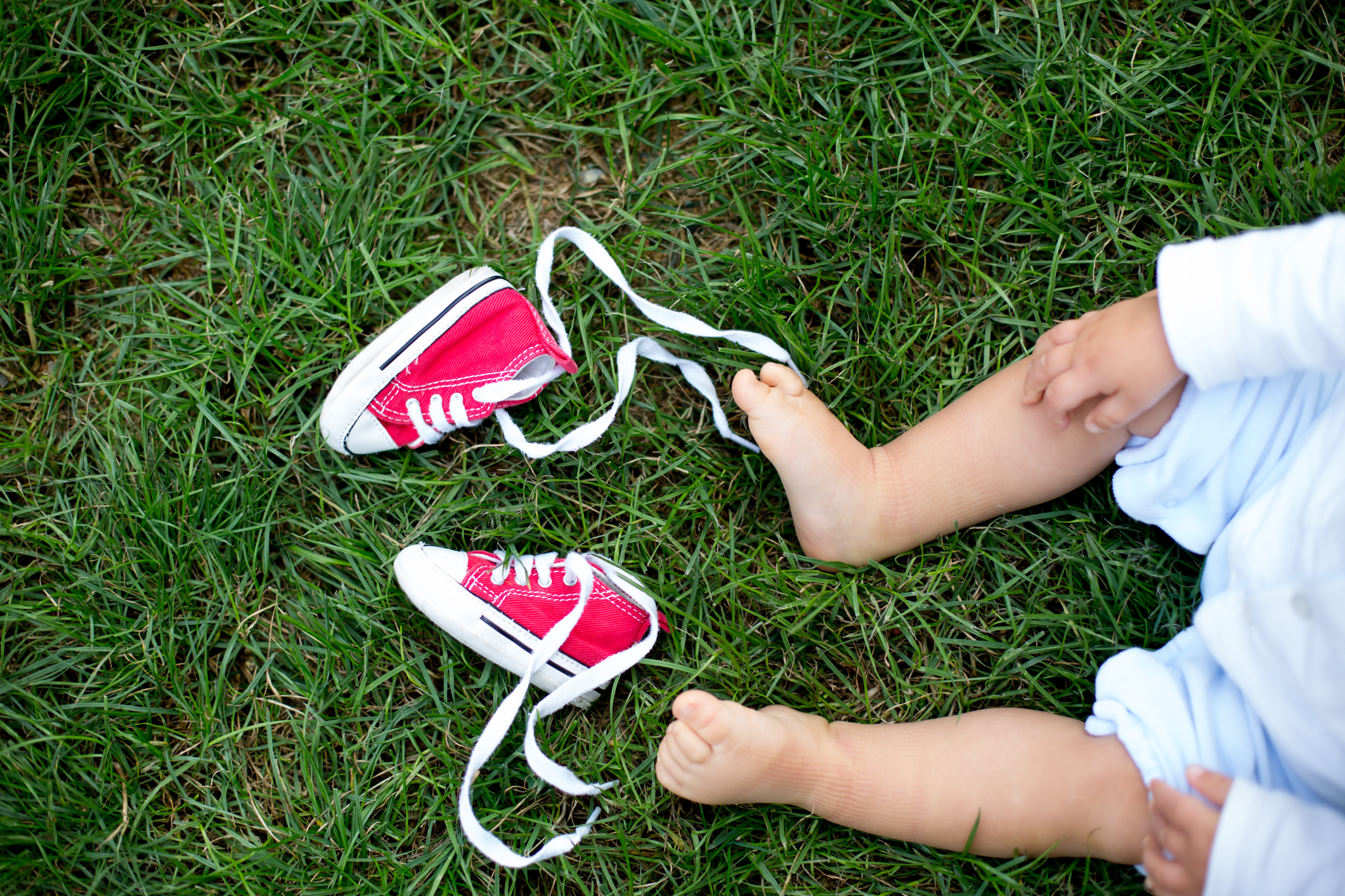 Bare baby feet and shoes