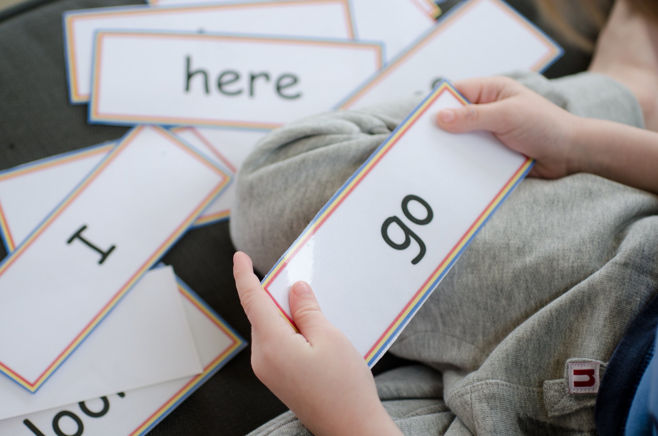 A child playing with flashcards